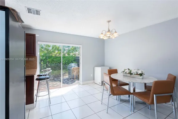 a kitchen with stainless steel appliances granite countertop wooden cabinets a stove a sink and dishwasher