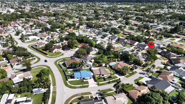 an aerial view of houses with outdoor space