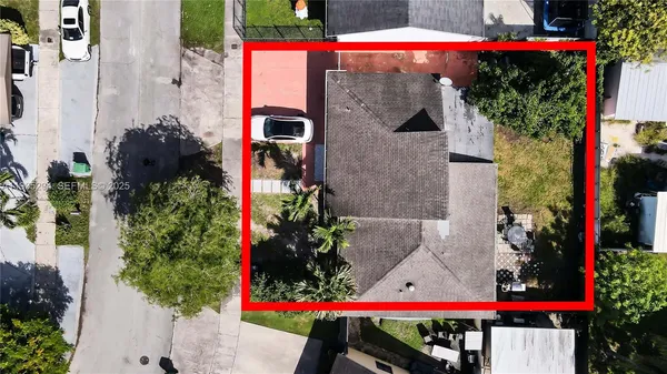 an aerial view of multiple houses with yard