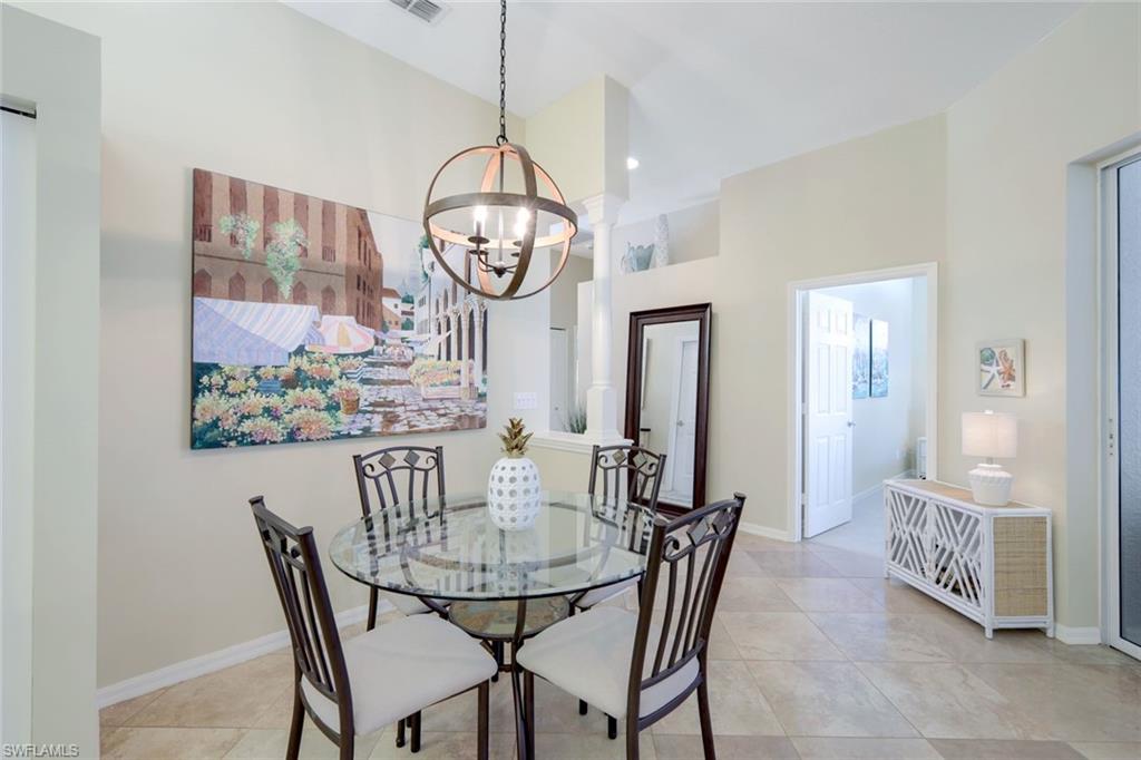 10215 Cape Roman Road, Unit 101 Estero, FL 34135 - Photo 12 of 50 a view of a dining room with furniture