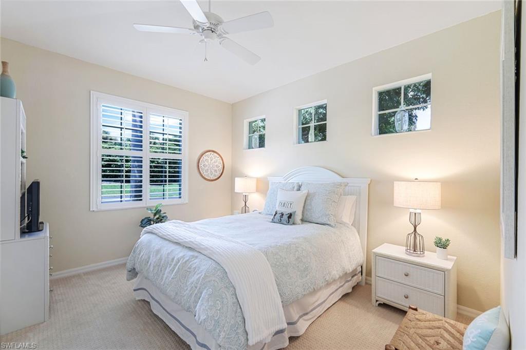 10215 Cape Roman Road, Unit 101 Estero, FL 34135 - Photo 16 of 50 a bedroom with bed and a window