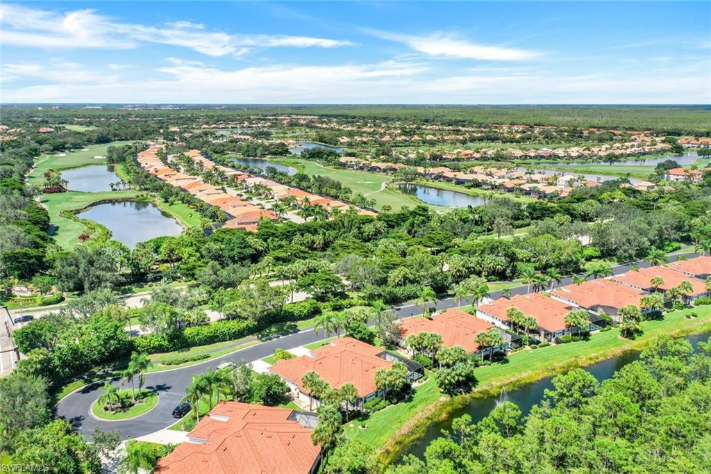 10215 Cape Roman Road, Unit 101 Estero, FL 34135 - Photo 28 of 50 an aerial view of residential houses with outdoor space