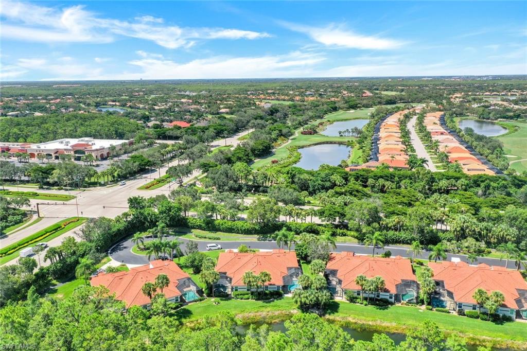 10215 Cape Roman Road, Unit 101 Estero, FL 34135 - Photo 29 of 50 an aerial view of city and lake