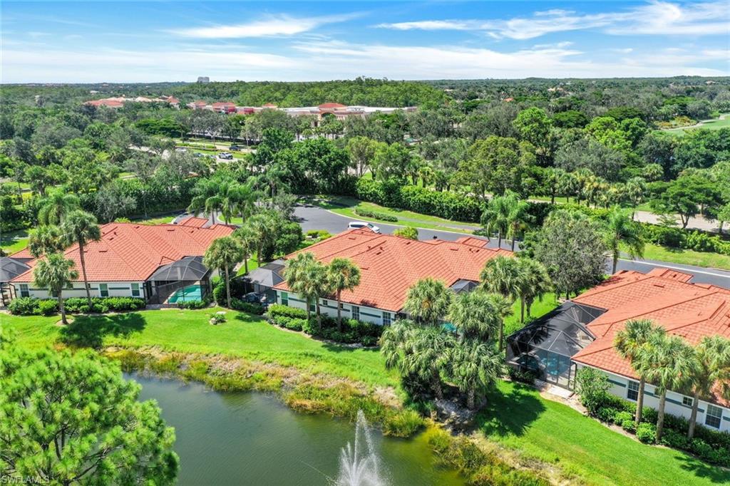 10215 Cape Roman Road, Unit 101 Estero, FL 34135 - Photo 30 of 50 an aerial view of residential houses with outdoor space and river