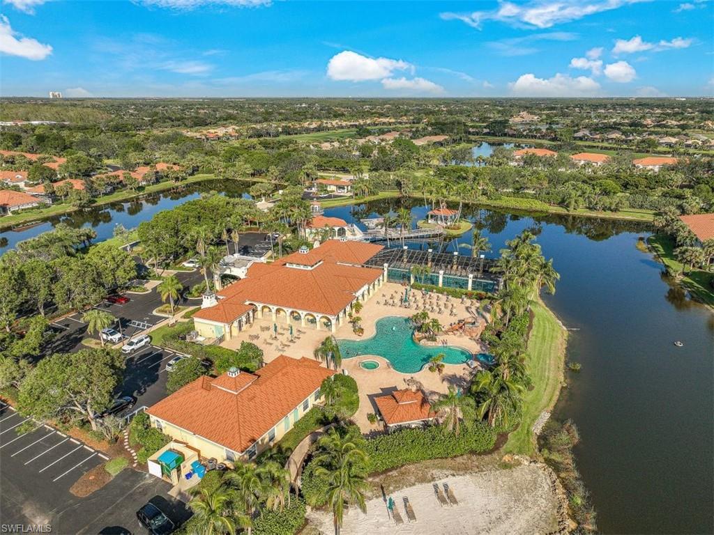 10215 Cape Roman Road, Unit 101 Estero, FL 34135 - Photo 31 of 50 an aerial view of residential houses with outdoor space