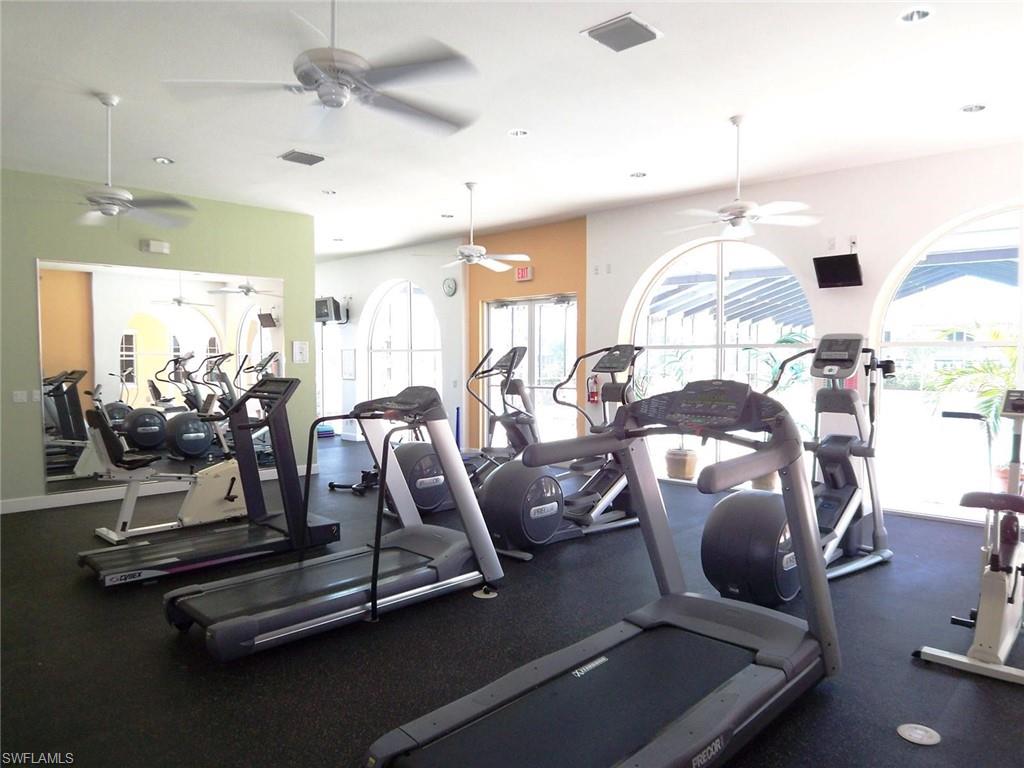 10215 Cape Roman Road, Unit 101 Estero, FL 34135 - Photo 34 of 50 a room with gym equipment