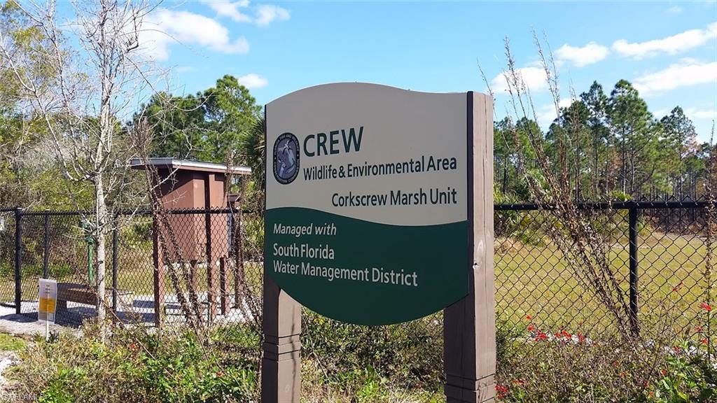 10215 Cape Roman Road, Unit 101 Estero, FL 34135 - Photo 49 of 50 a sign on the side of a building
