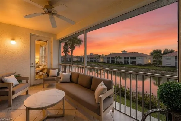 a view of balcony with furniture