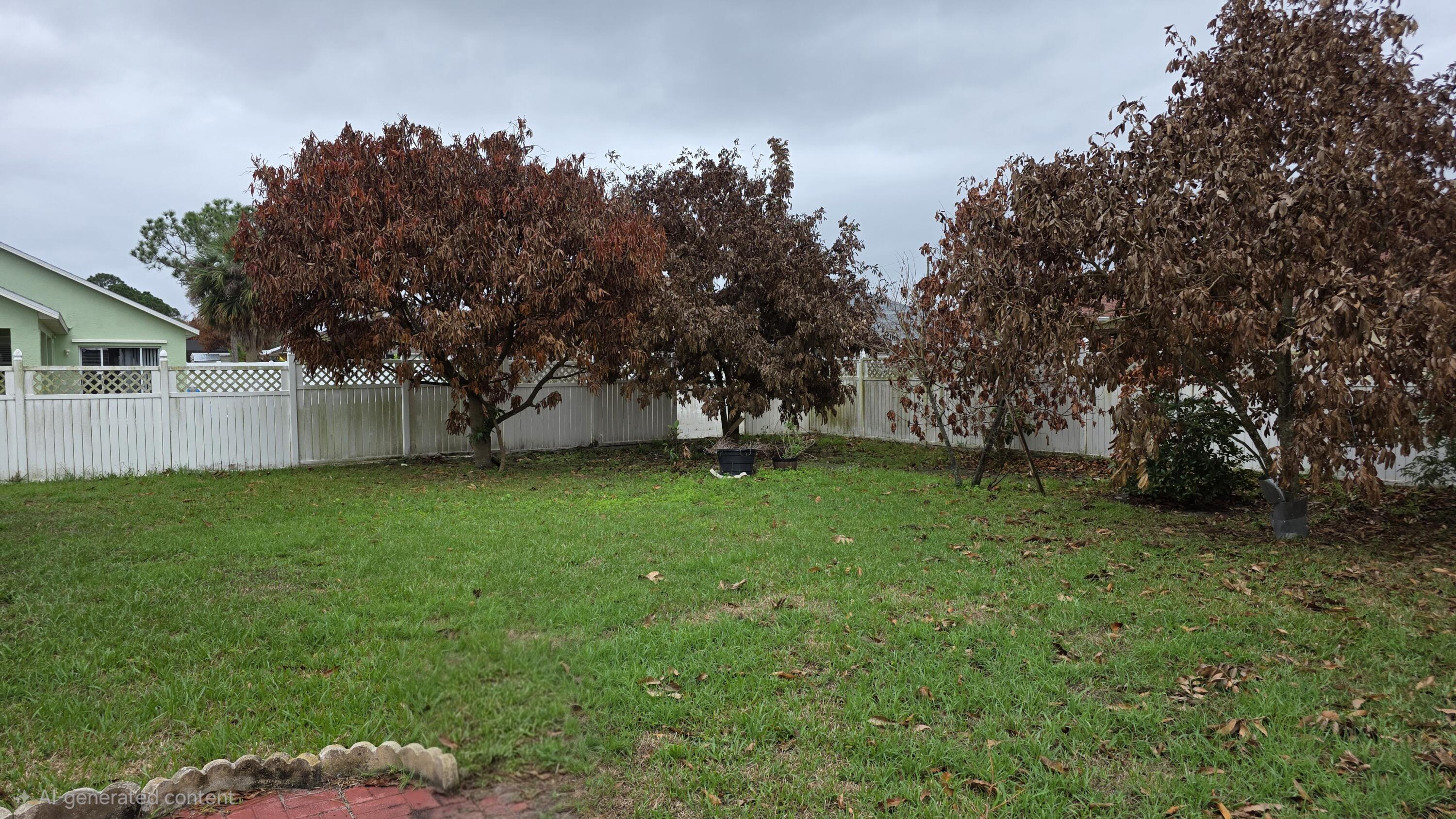 6448 Northwest Colgate Street Port St. Lucie, FL 34986 - Photo 21 of 21 a view of a backyard with a garden
