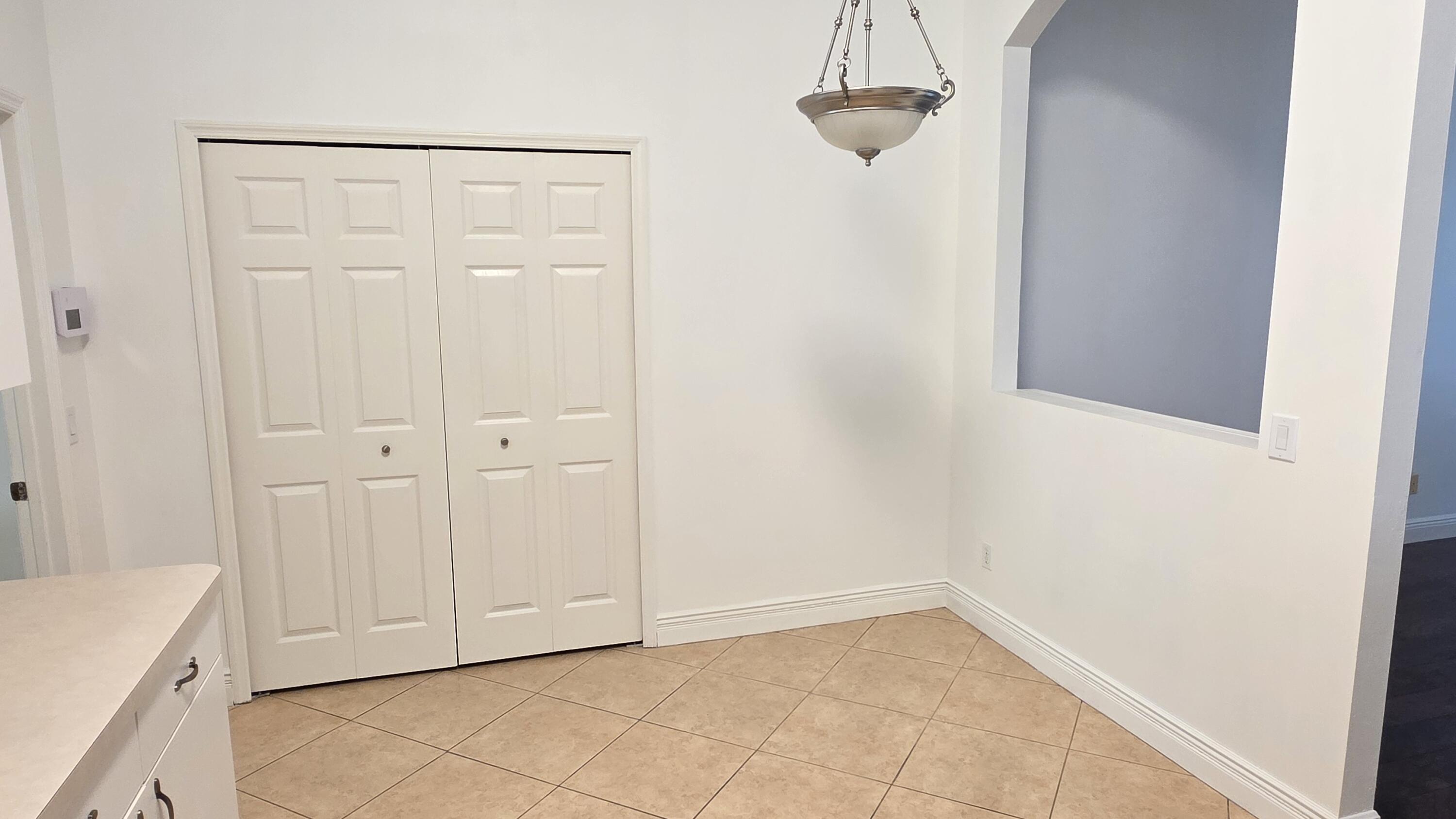 6448 Northwest Colgate Street Port St. Lucie, FL 34986 - Photo 9 of 21 a view of an empty room