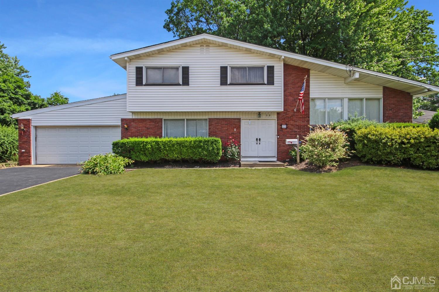 22 Bruning Road East Brunswick, NJ 08816 - Photo 2 of 31 a front view of a house with garden