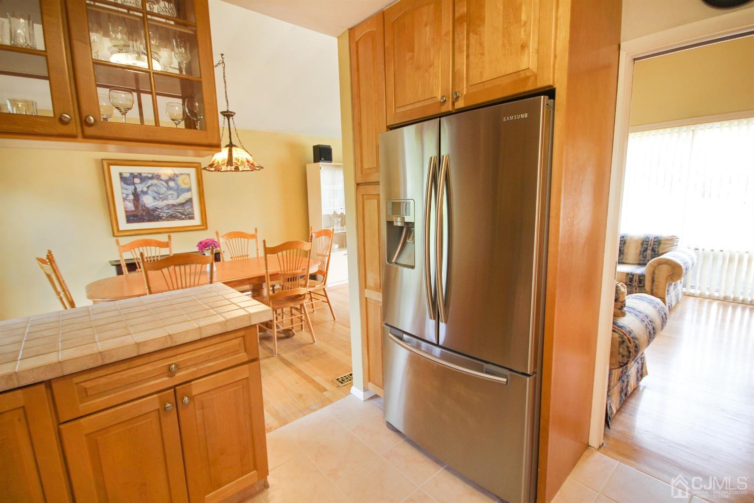22 Bruning Road East Brunswick, NJ 08816 - Photo 18 of 31 a kitchen with stainless steel appliances a refrigerator and a stove