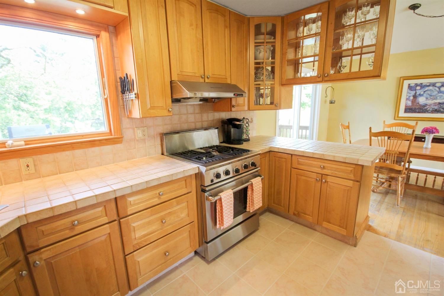 22 Bruning Road East Brunswick, NJ 08816 - Photo 19 of 31 a kitchen with a stove a sink and a window