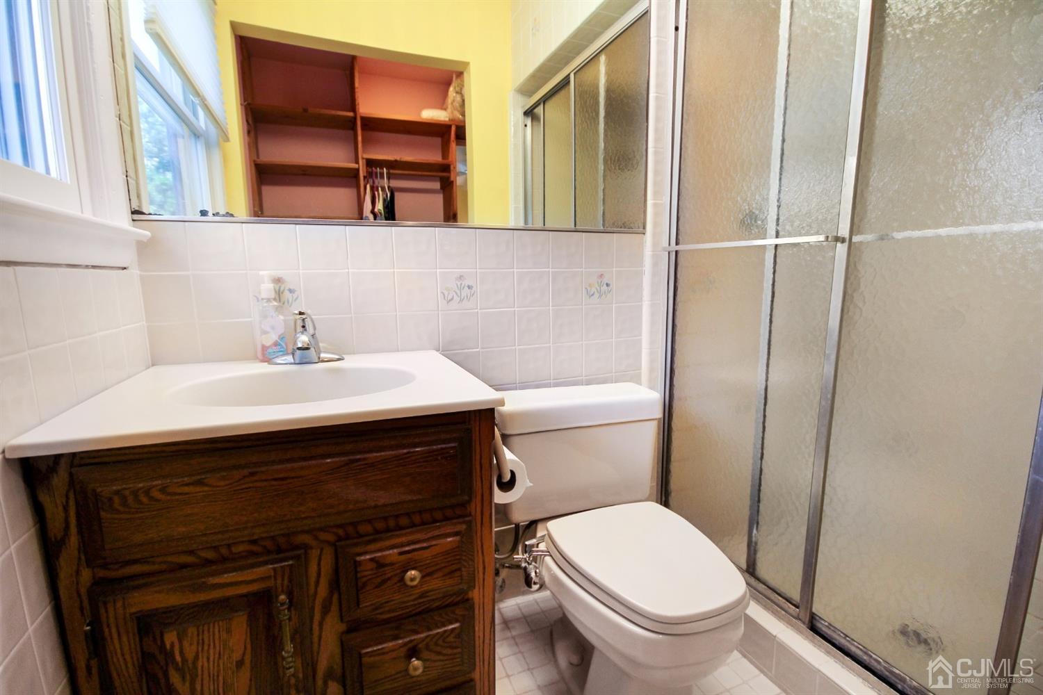 22 Bruning Road East Brunswick, NJ 08816 - Photo 23 of 31 a bathroom with a sink a toilet and shower