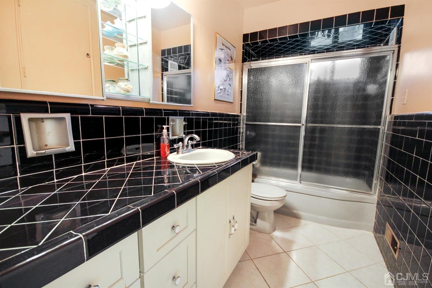 22 Bruning Road East Brunswick, NJ 08816 - Photo 26 of 31 a bathroom with a toilet a sink and shower