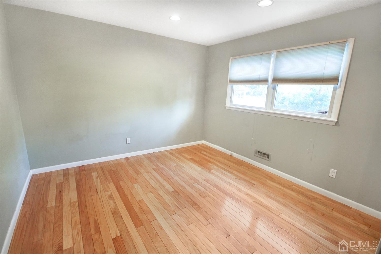 22 Bruning Road East Brunswick, NJ 08816 - Photo 30 of 31 a view of room with wooden floor and fan
