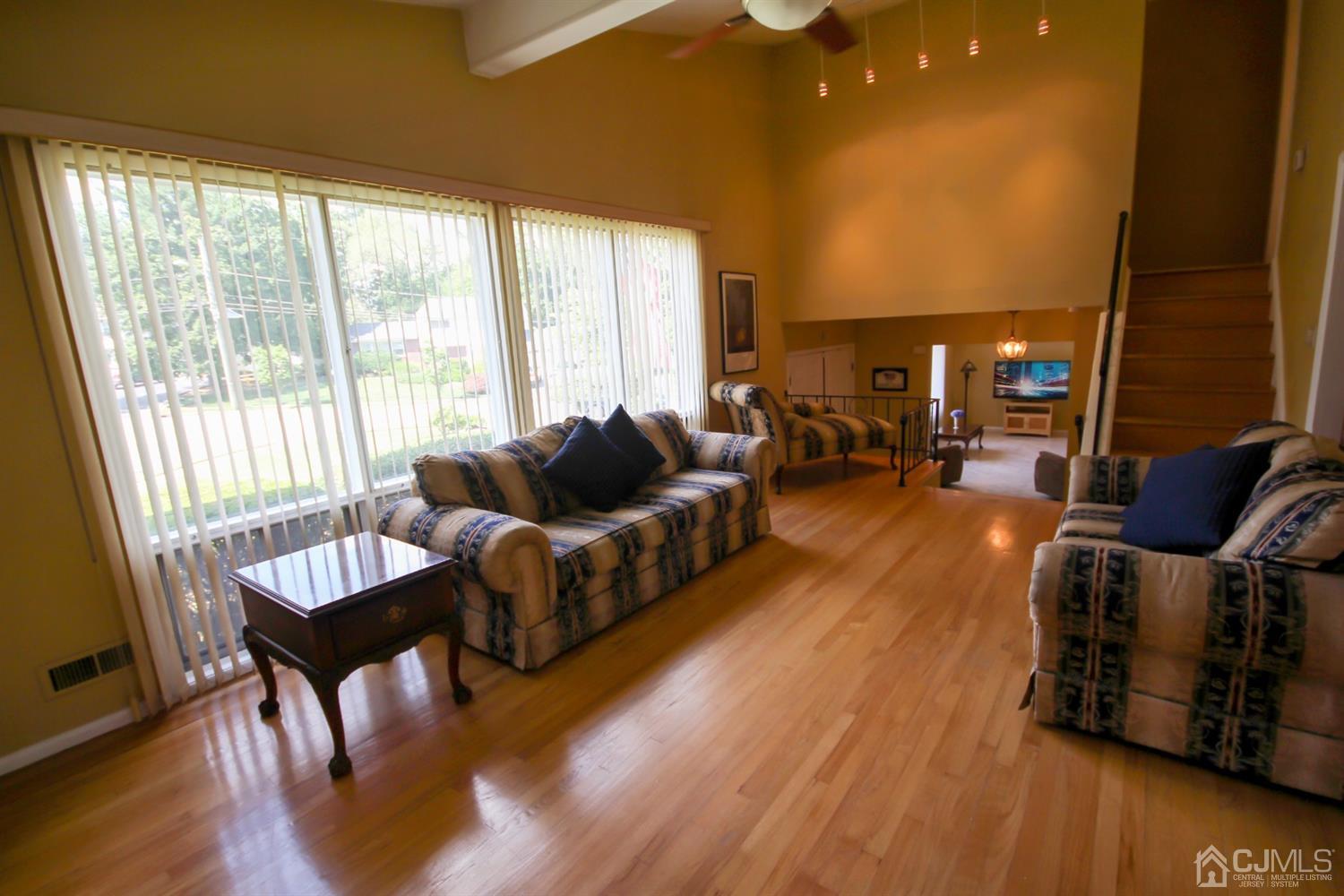 22 Bruning Road East Brunswick, NJ 08816 - Photo 10 of 31 a living room with furniture and a wooden floor