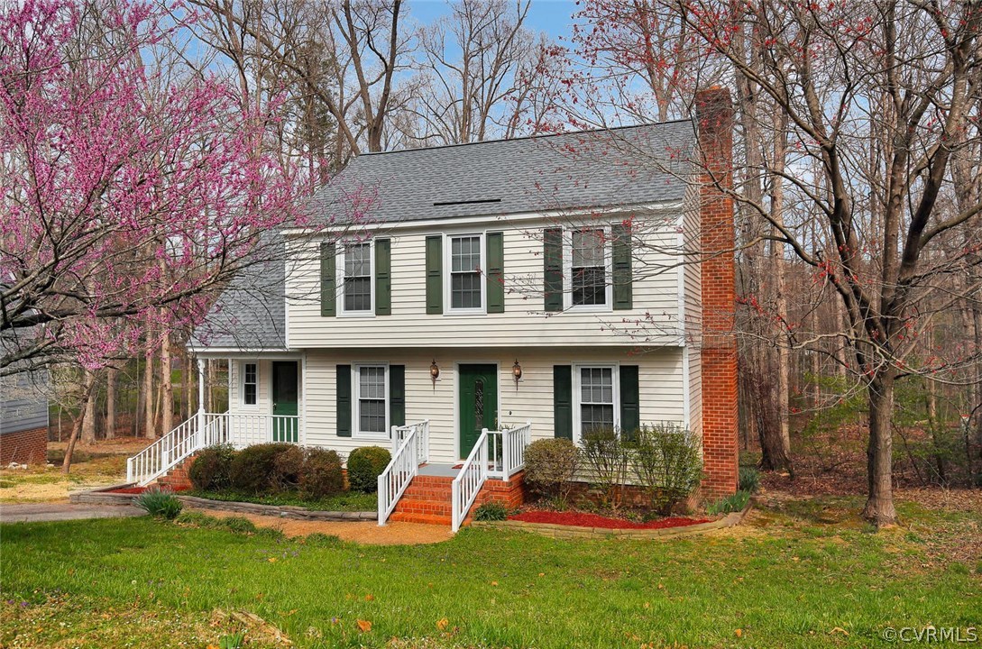 front view of a house with a yard