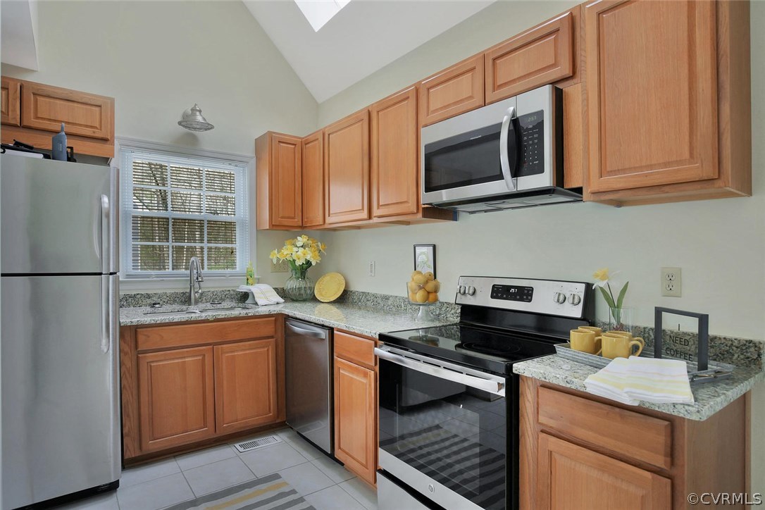 4732 Cedar Cliff Road Chester, VA 23831 - Photo 11 of 25 a kitchen with stainless steel appliances granite countertop a sink stove and microwave