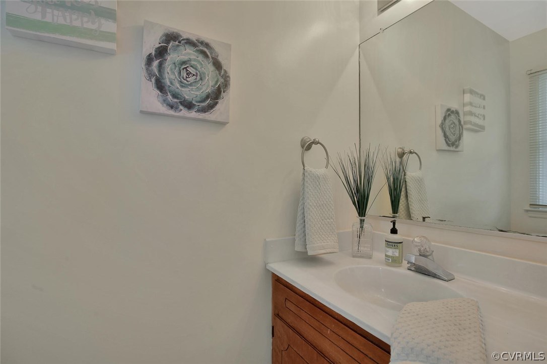 4732 Cedar Cliff Road Chester, VA 23831 - Photo 14 of 25 a bathroom with a sink and a mirror