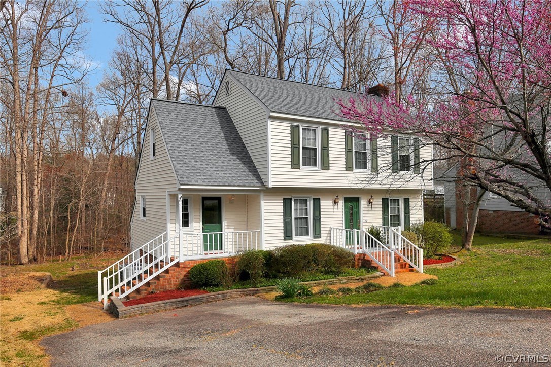 4732 Cedar Cliff Road Chester, VA 23831 - Photo 2 of 25 a front view of a house with garden