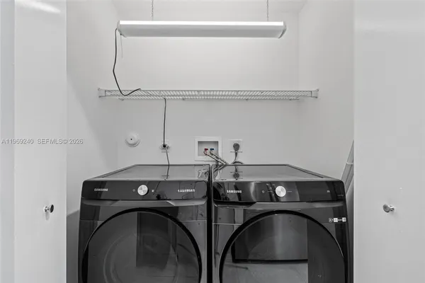 a white toilet sitting next to a shower