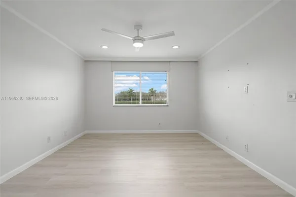 a bathroom with a glass door shower a sink and a mirror