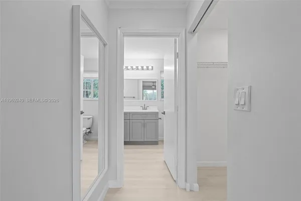 a bathroom with a double vanity sink mirror and