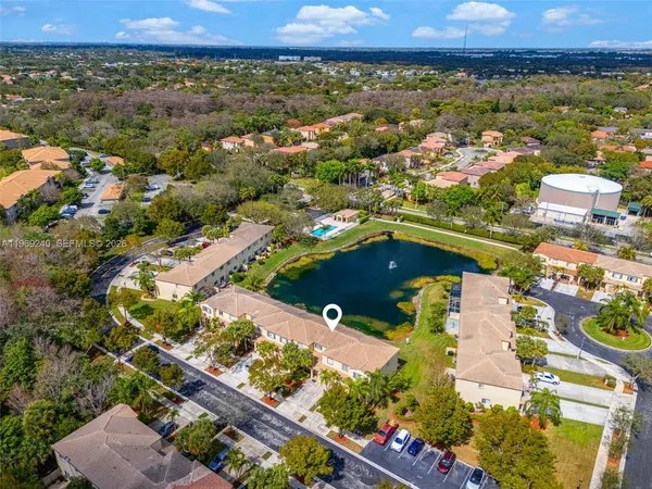 an aerial view of residential houses with outdoor space