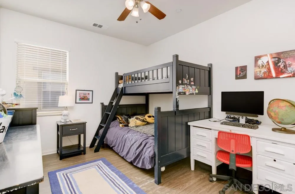 3684 Tavara Circle San Diego, CA 92117 - Photo 13 of 22 a bedroom with bed and a window