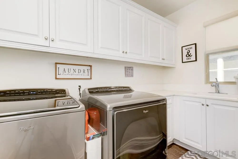 3684 Tavara Circle San Diego, CA 92117 - Photo 16 of 22 a utility room with dryer and washer