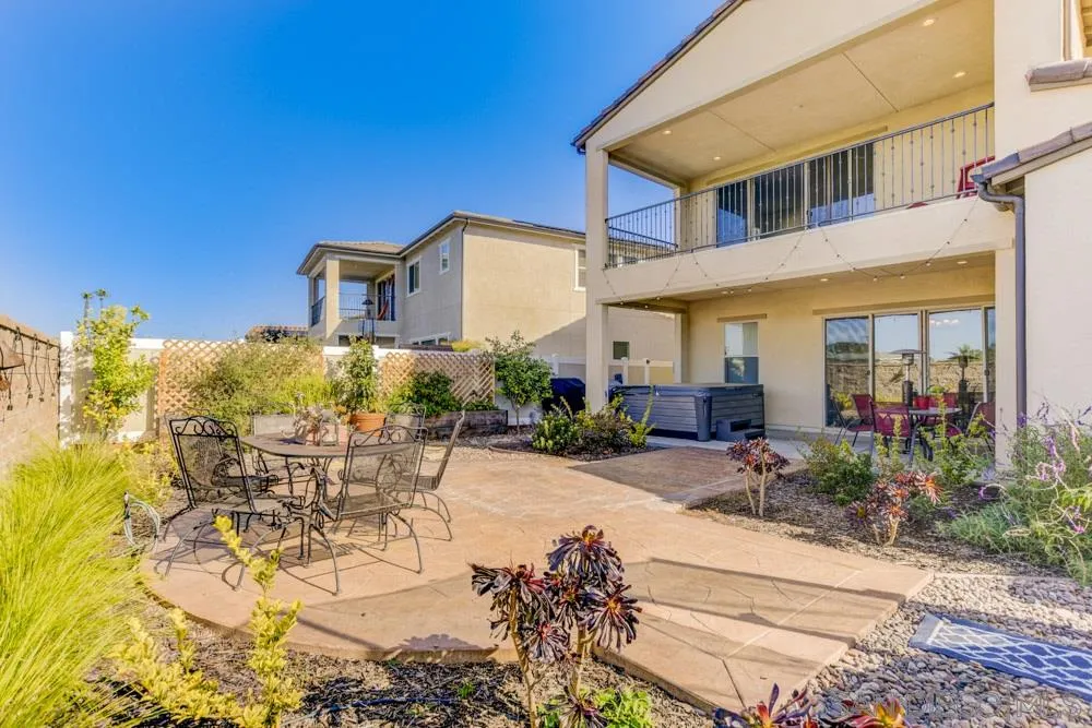 3684 Tavara Circle San Diego, CA 92117 - Photo 21 of 22 a view of a patio with table and chairs and potted plants
