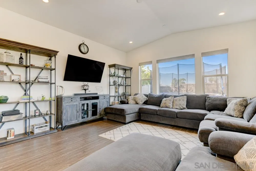 3684 Tavara Circle San Diego, CA 92117 - Photo 4 of 22 a living room with furniture and a flat screen tv