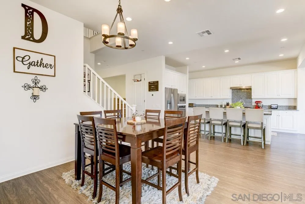 3684 Tavara Circle San Diego, CA 92117 - Photo 6 of 22 a view of a dining room with furniture