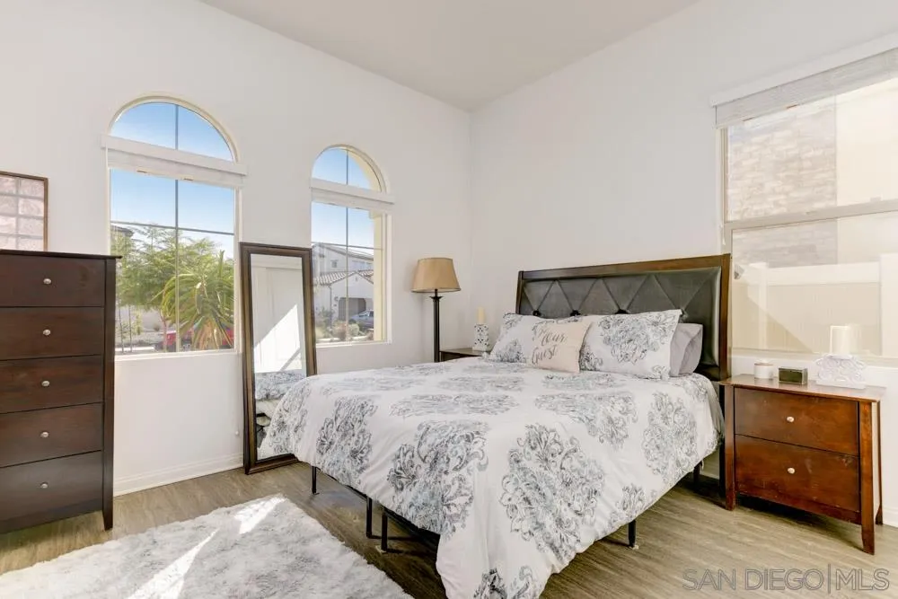 3684 Tavara Circle San Diego, CA 92117 - Photo 8 of 22 a bedroom with a bed and a window