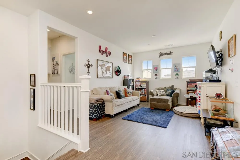 3684 Tavara Circle San Diego, CA 92117 - Photo 10 of 22 a living room with furniture and a flat screen tv