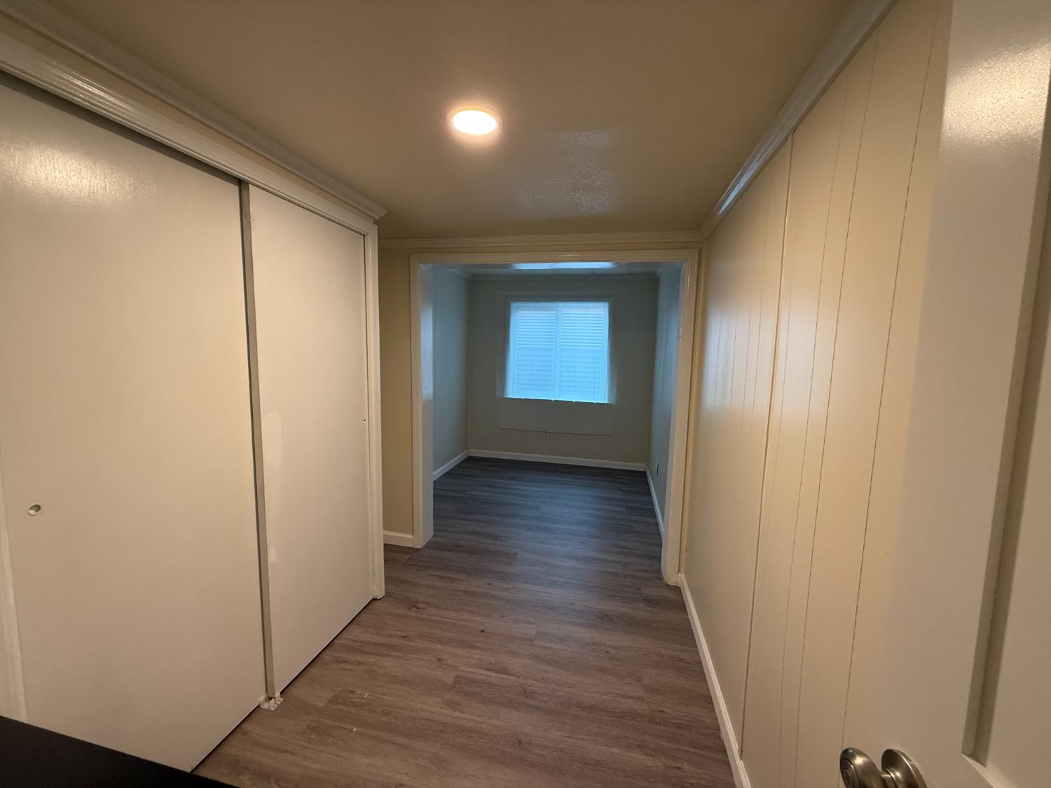10035 Mills Station Road, Unit 16 Sacramento, CA 95827 - Photo 11 of 21 a view of a hallway with wooden floor