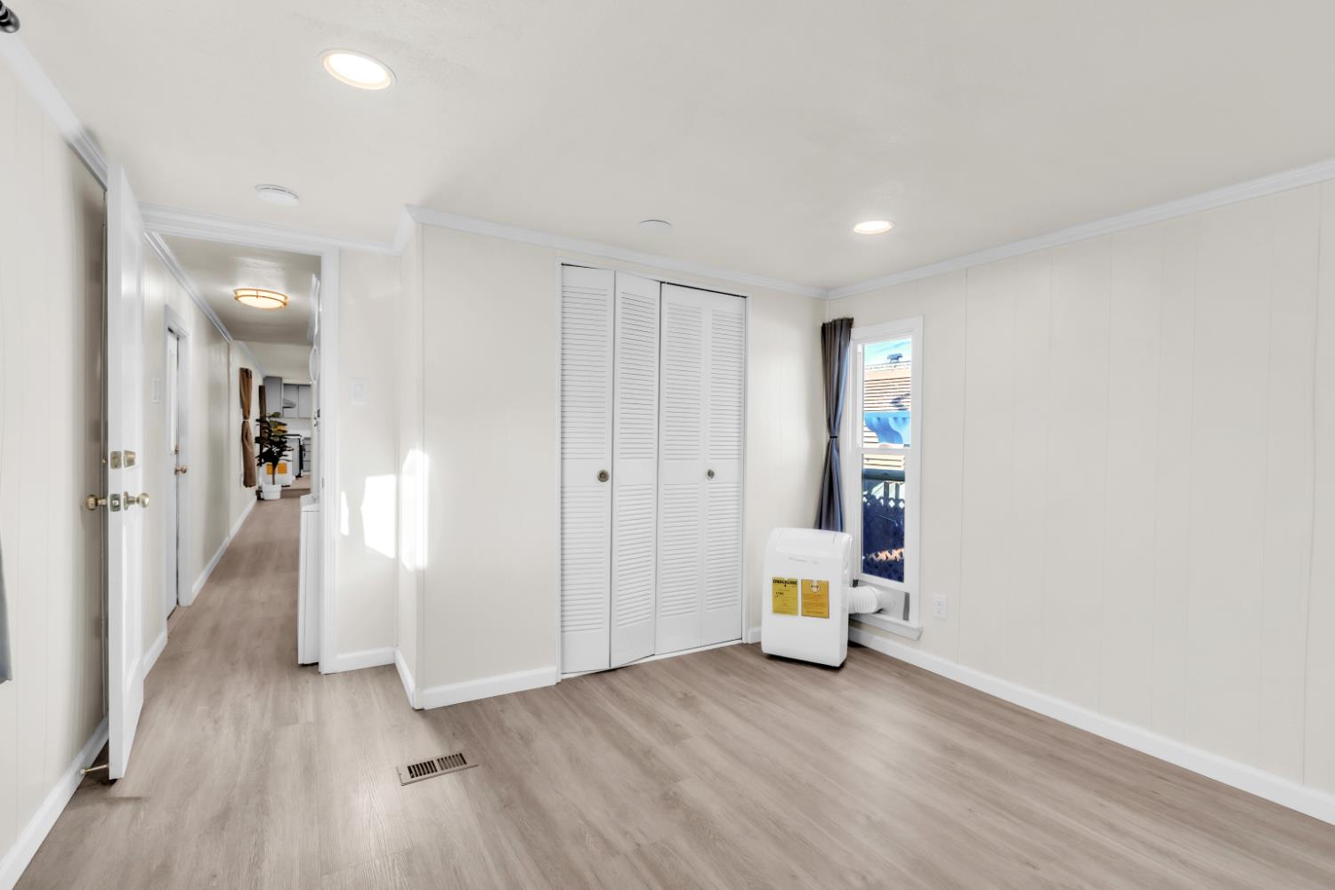 10035 Mills Station Road, Unit 16 Sacramento, CA 95827 - Photo 19 of 27 a view of a hallway with wooden floor