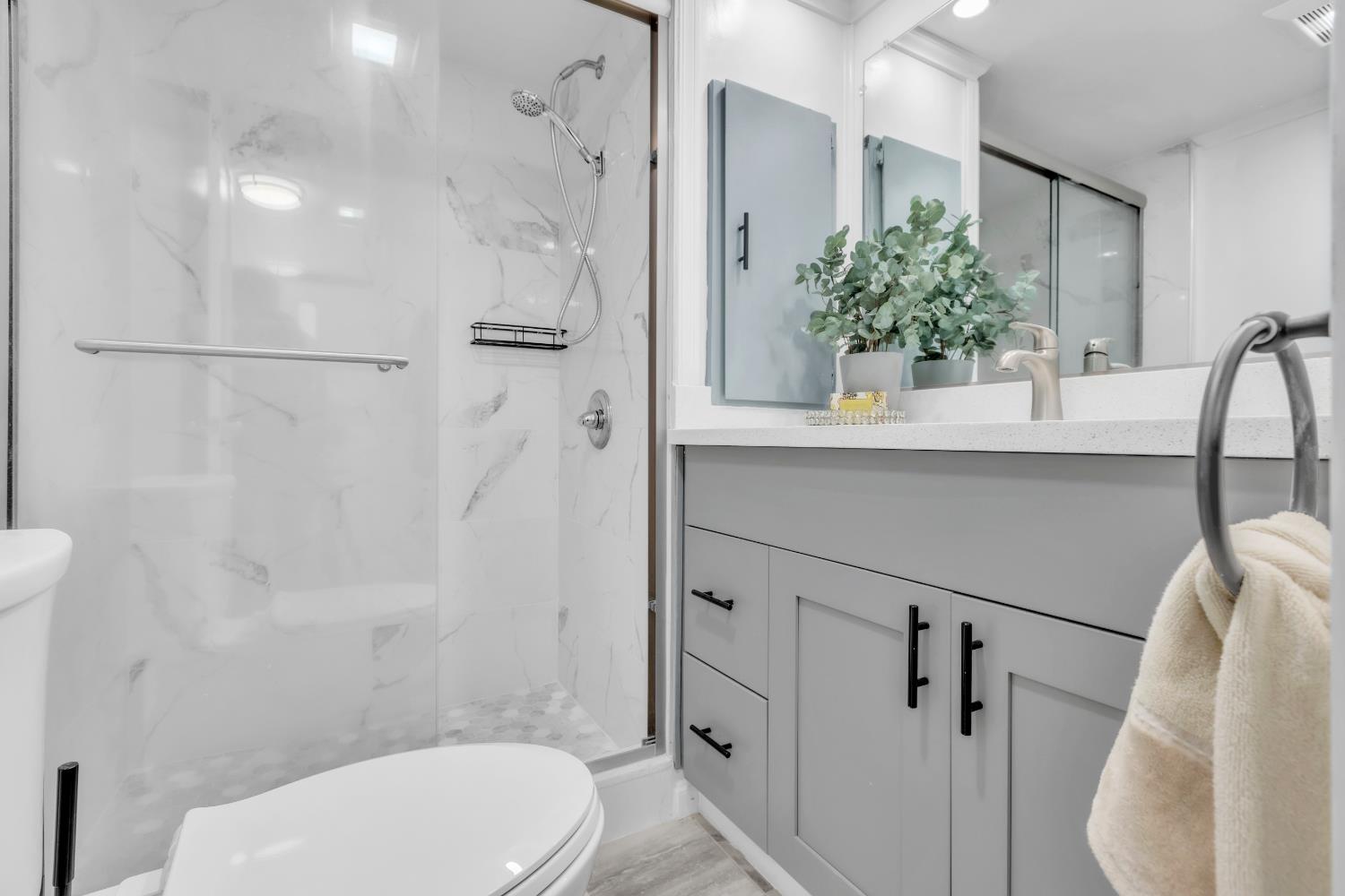 10035 Mills Station Road, Unit 16 Sacramento, CA 95827 - Photo 21 of 27 a bathroom with a sink a toilet and shower