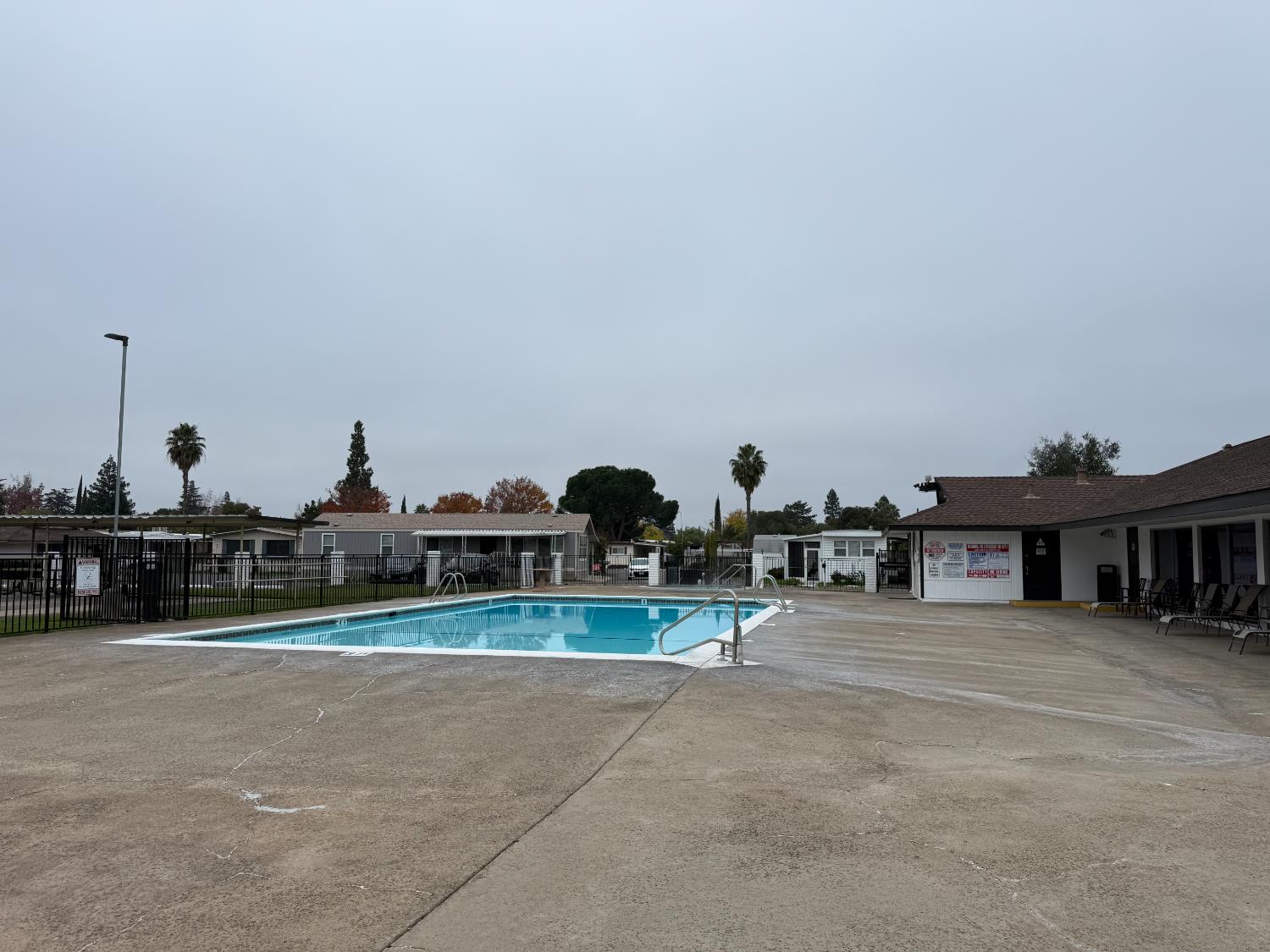 10035 Mills Station Road, Unit 16 Sacramento, CA 95827 - Photo 21 of 21 a group of people sitting in a parking area in front of building