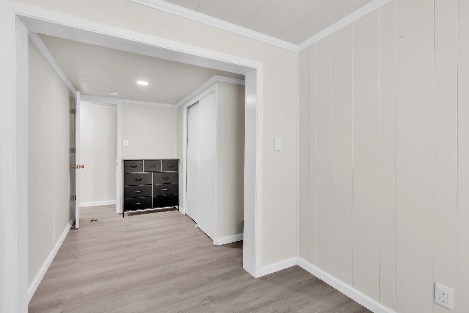 10035 Mills Station Road, Unit 16 Sacramento, CA 95827 - Photo 23 of 27 a view of hallway with wooden floor