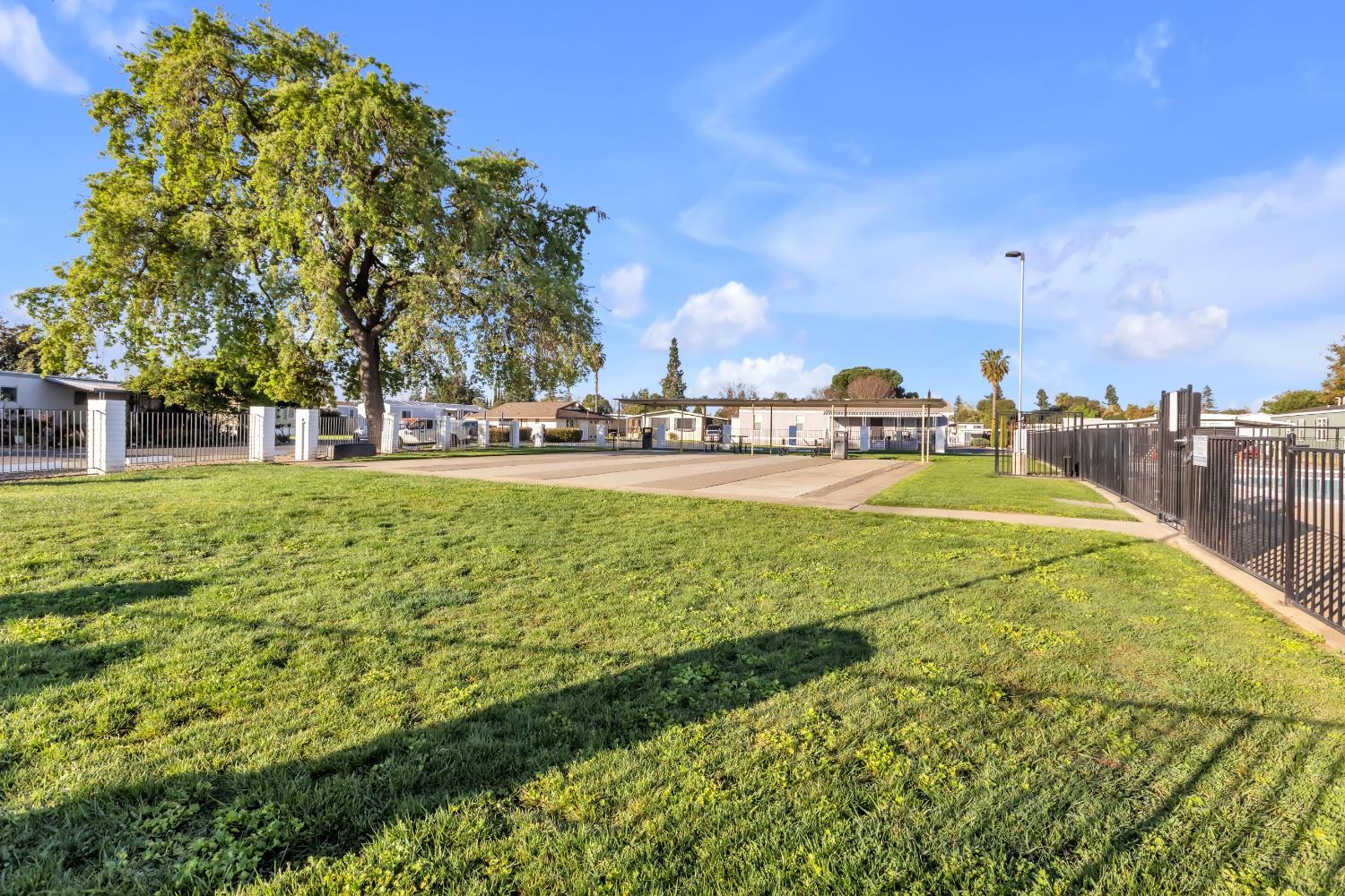10035 Mills Station Road, Unit 16 Sacramento, CA 95827 - Photo 25 of 27 a view of a playground with basketball court