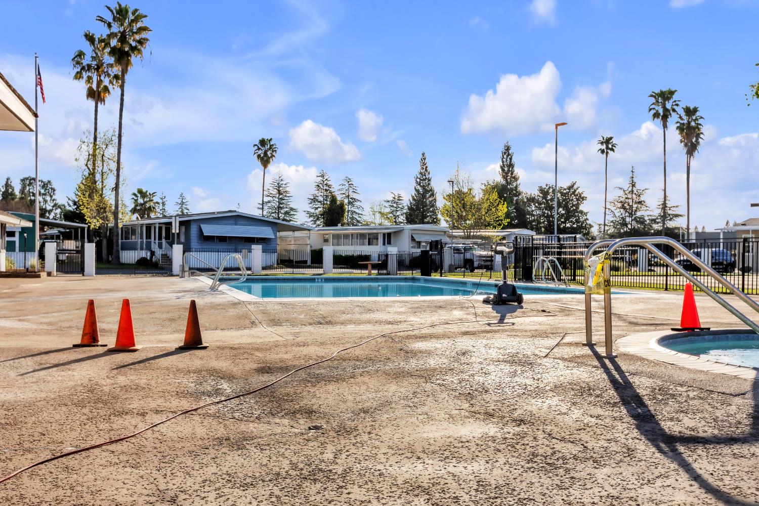 10035 Mills Station Road, Unit 16 Sacramento, CA 95827 - Photo 26 of 27 a view of a swimming pool with a lounge chairs