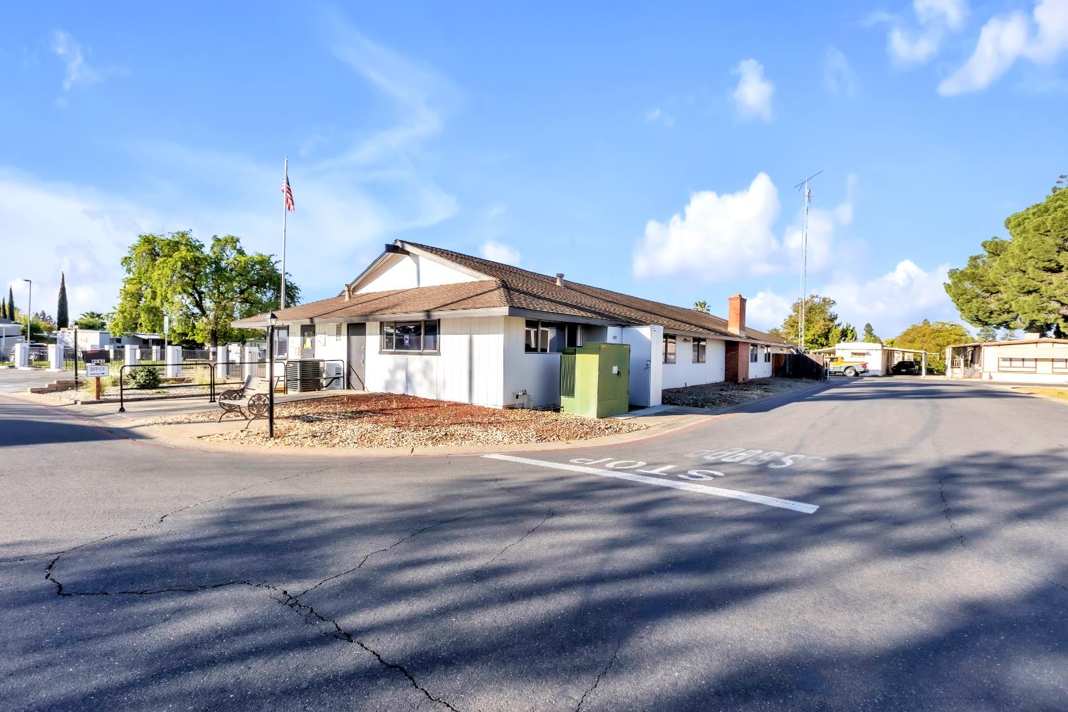 10035 Mills Station Road, Unit 16 Sacramento, CA 95827 - Photo 27 of 27 a front view of a house with a yard and garage