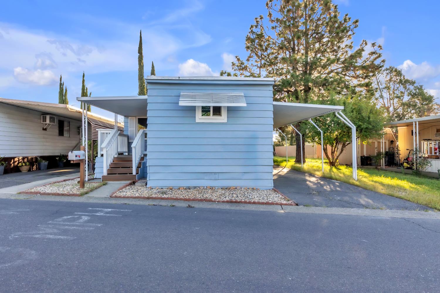 10035 Mills Station Road, Unit 16 Sacramento, CA 95827 - Photo 3 of 27 a view of a house with backyard and a area