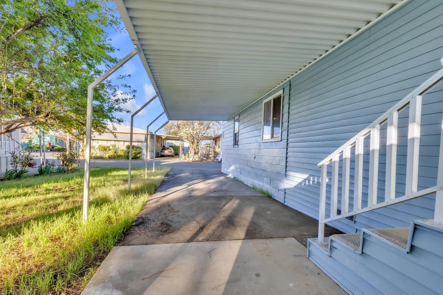 10035 Mills Station Road, Unit 16 Sacramento, CA 95827 - Photo 5 of 27 a view of a porch with garden