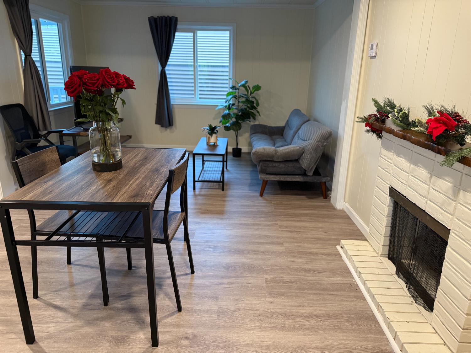 10035 Mills Station Road, Unit 16 Sacramento, CA 95827 - Photo 7 of 21 a living room with furniture and a fireplace