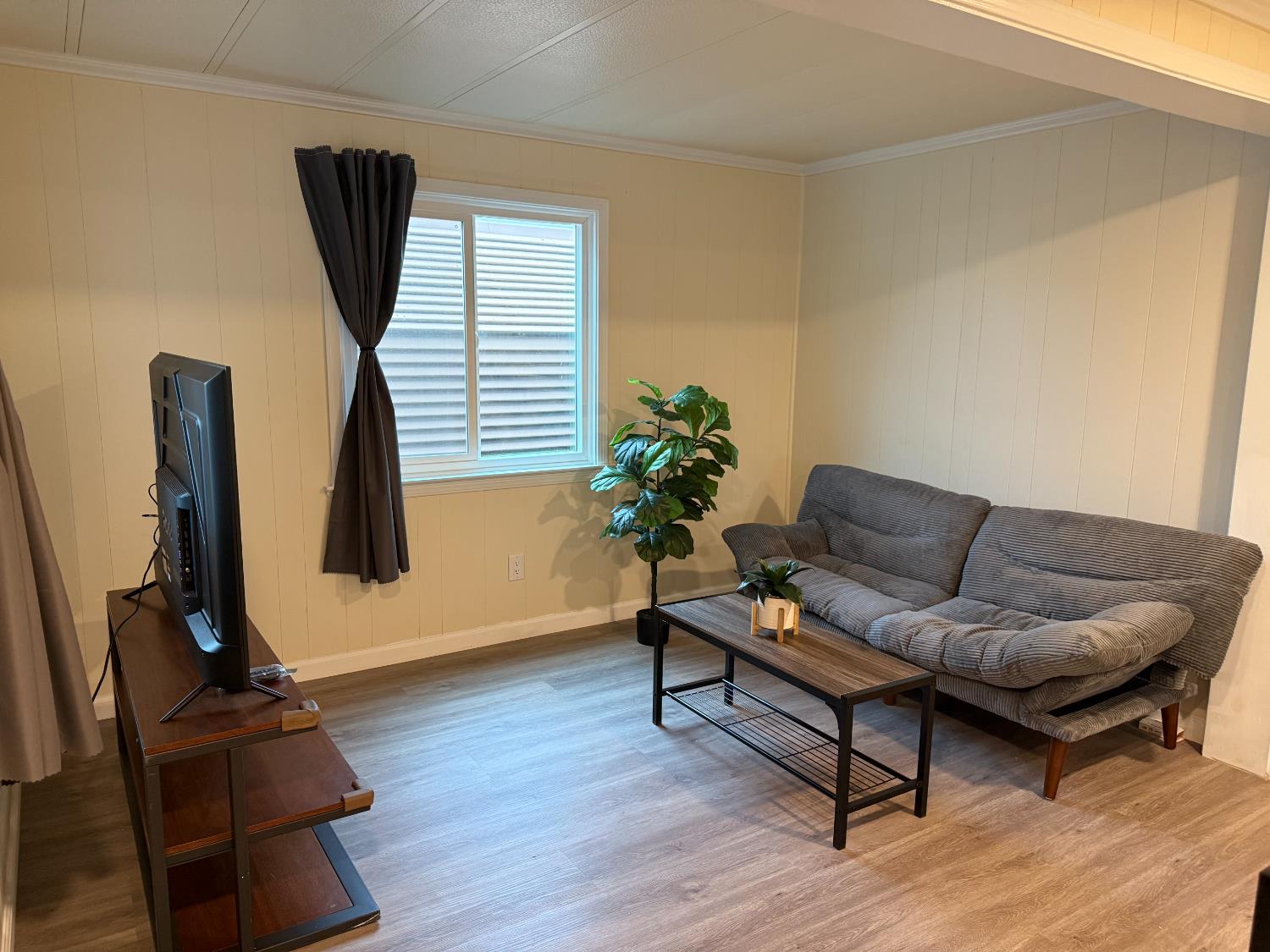 10035 Mills Station Road, Unit 16 Sacramento, CA 95827 - Photo 8 of 21 a living room with furniture and a window