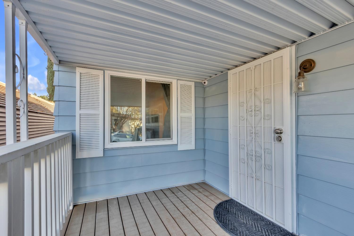 10035 Mills Station Road, Unit 16 Sacramento, CA 95827 - Photo 8 of 27 a view of outdoor space with wooden floor and window