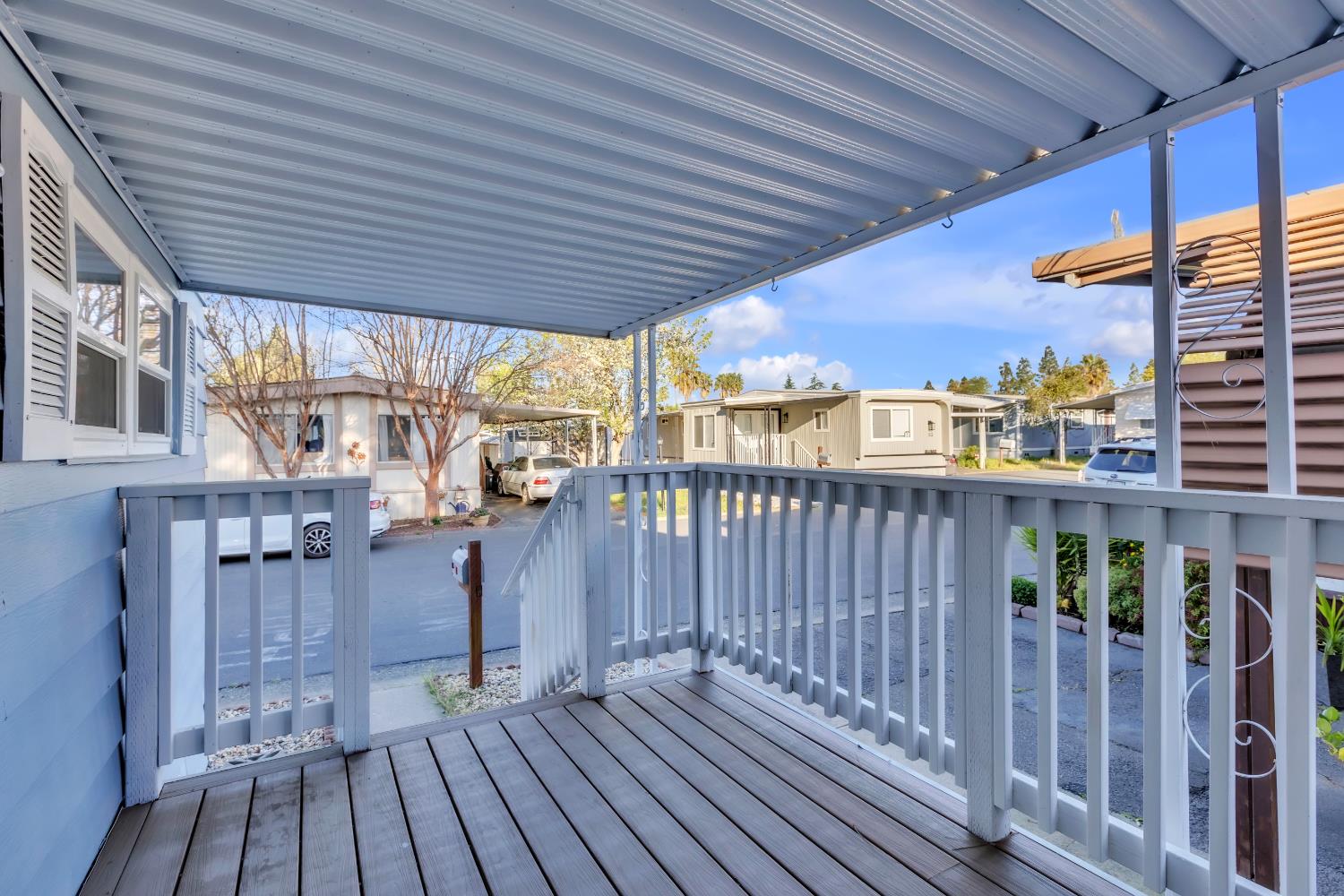 10035 Mills Station Road, Unit 16 Sacramento, CA 95827 - Photo 9 of 27 a view of a balcony with wooden floor